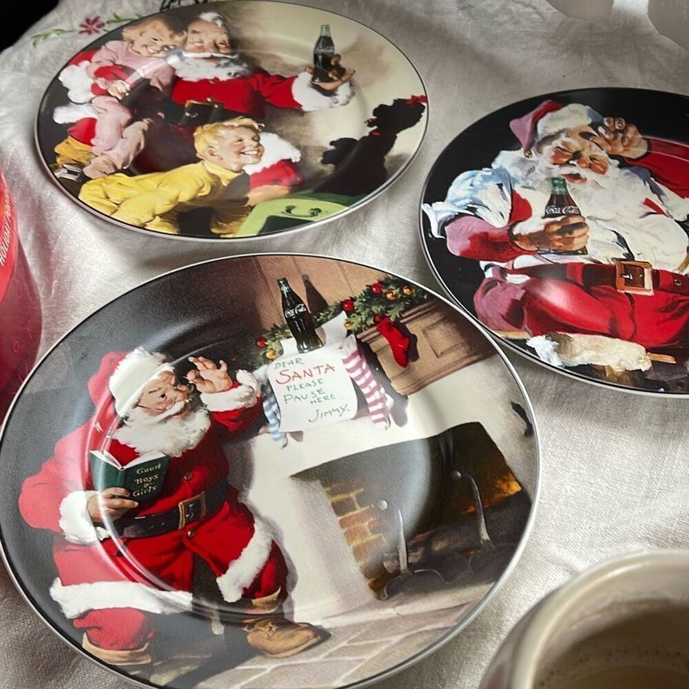 Lot of 3 Coca-Cola Santa plates in original box.